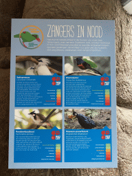 Explanation on Asian songbird species at the Nature Conservation Center at the Oceanium at the Diergaarde Blijdorp zoo
