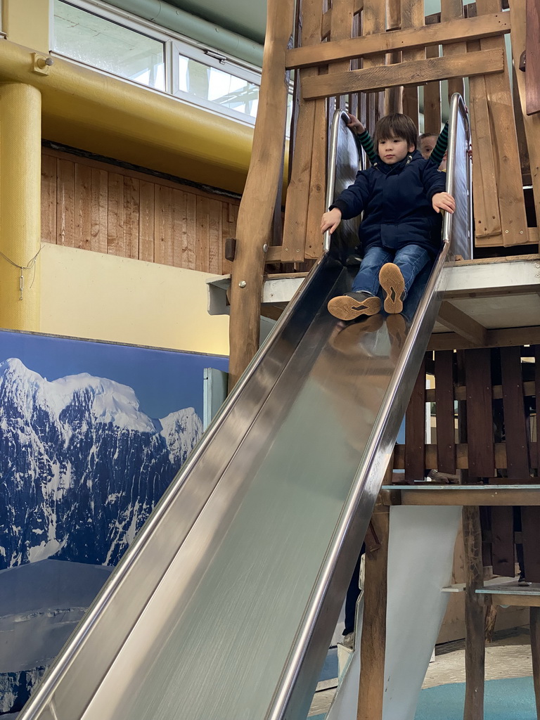 Max on a slide at the Biotopia playground in the Rivièrahal building at the Africa area at the Diergaarde Blijdorp zoo