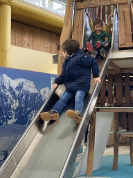 Max on a slide at the Biotopia playground in the Rivièrahal building at the Africa area at the Diergaarde Blijdorp zoo