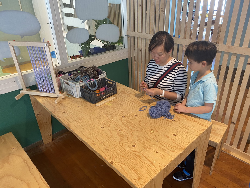 Miaomiao and Max playing with textile at the Stop! Monsters! exhibition at the lower floor of the Villa Zebra museum