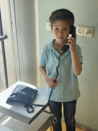 Max with a telephone at the Bij de Dokter exhibition at the lower floor of the Villa Zebra museum