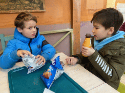 Max and his friend eating and drinking at the Caribbean Café at the Oceanium at the Diergaarde Blijdorp zoo