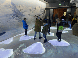 Max and his friend with projected ice floes at the Falklands section at the Oceanium at the Diergaarde Blijdorp zoo