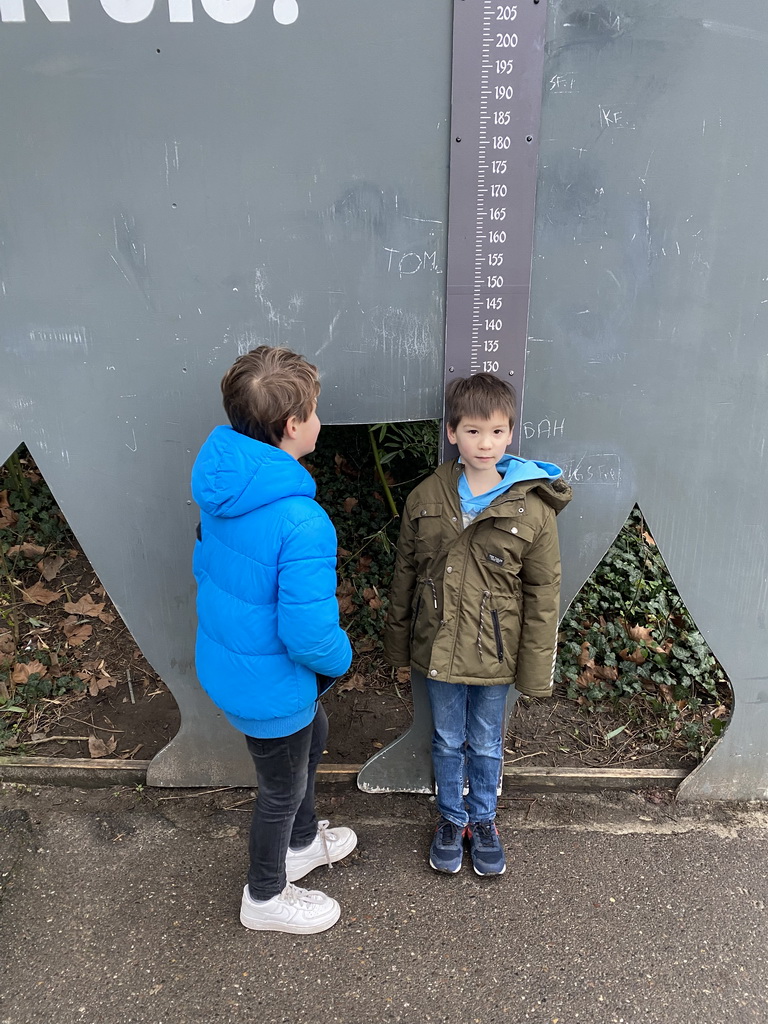 Max and his friend with an elephant tape measure at the Asia area at the Diergaarde Blijdorp zoo