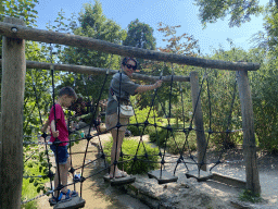 Miaomiao and Max on a rope bridge at the Avonturenbeen attraction at the Dierenwijck area of the Plaswijckpark recreation park