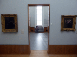 Two paintings and Miaomiao sitting on a sofa at the First Floor of the Museum Boijmans van Beuningen