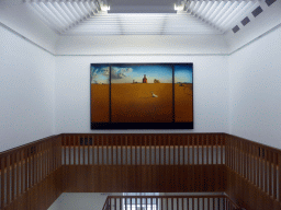 Staircase at the First Floor of the Museum Boijmans van Beuningen, with the painting `Landscape with a girl skipping rope` by Salvador Dalí