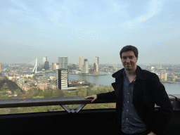Tim at the lower viewing platform of the Euromast tower, with a view on the Park, the Westerlaantoren tower, the Erasmusbrug bridge over the Nieuwe Maas river and skyscrapers in the city center