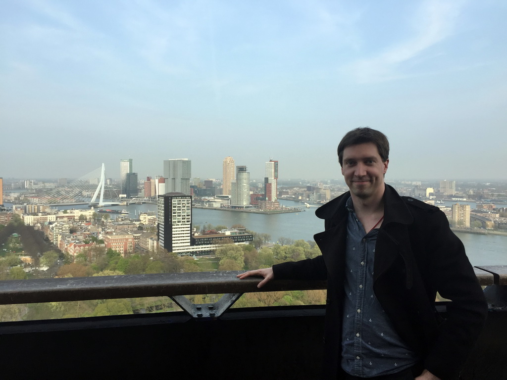 Tim at the lower viewing platform of the Euromast tower, with a view on the Park, the Westerlaantoren tower, the Erasmusbrug bridge over the Nieuwe Maas river and skyscrapers in the city center