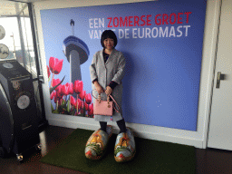 Miaomiao in wooden shoes, at the entrance to the viewing platforms of the Euromast tower