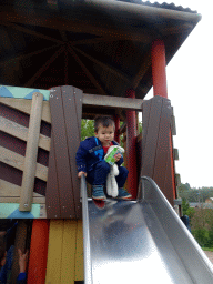 Max on the slide at the playground in front of the theatre of the Vrije Vlucht Voorstelling at the South America area at the Diergaarde Blijdorp zoo