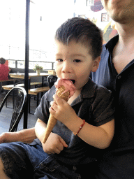 Max eating an ice cream at our lunch restaurant 21 Pinchos in the Markthal building