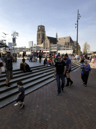Max at the Binnenrotte square, with a view on the Grote of Sint-Laurenskerk church