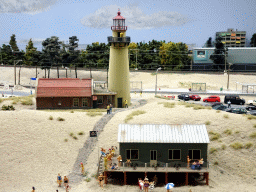 Scale model of a lighthouse and beach pavilion at Miniworld Rotterdam