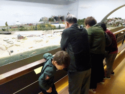 Max, Miaomiao and Miaomiao`s parents looking at the beach area at Miniworld Rotterdam