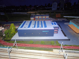 Scale model of the Regoort building at Miniworld Rotterdam, in the dark