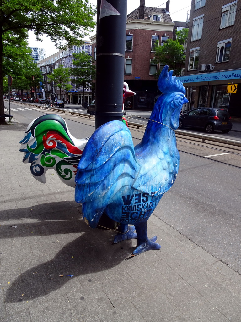 Rooster statues at the West-Kruiskade street