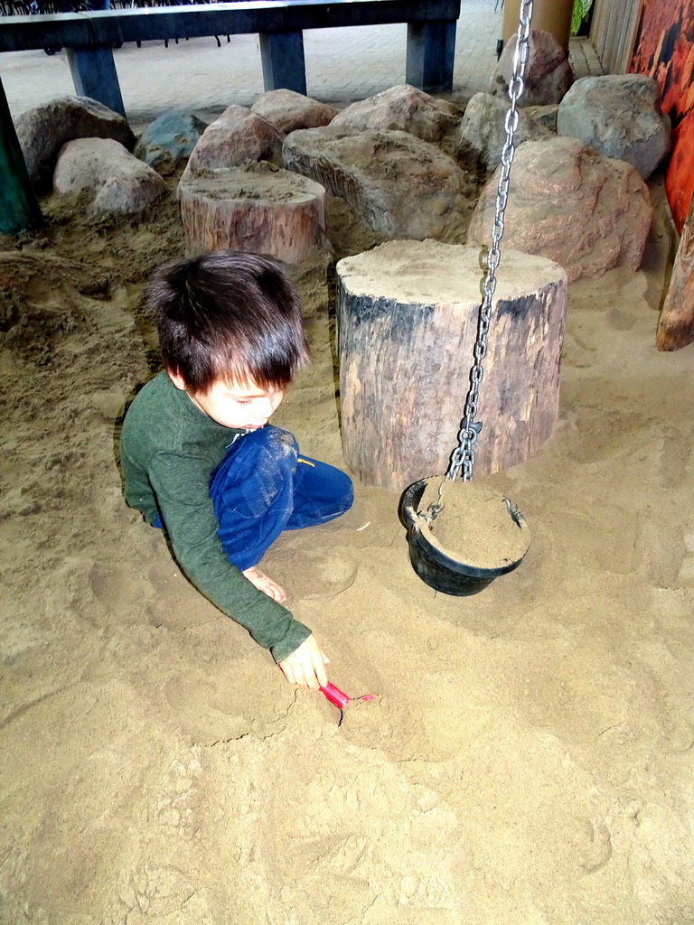 Max playing with sand at the Biotopia playground in the Rivièrahal building at the Africa area at the Diergaarde Blijdorp zoo