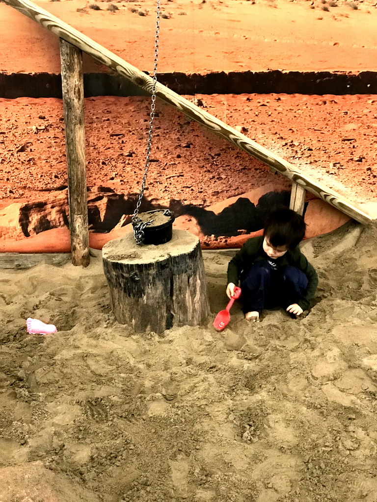 Max playing with sand at the Biotopia playground in the Rivièrahal building at the Africa area at the Diergaarde Blijdorp zoo