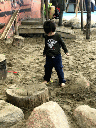 Max playing with sand at the Biotopia playground in the Rivièrahal building at the Africa area at the Diergaarde Blijdorp zoo