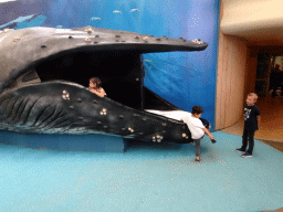 Max with a Whale statue at the Biotopia playground in the Rivièrahal building at the Africa area at the Diergaarde Blijdorp zoo