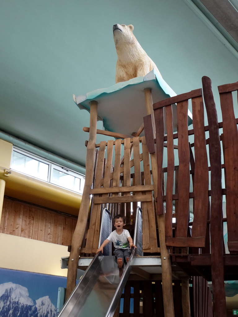 Max on a slide at the Biotopia playground in the Rivièrahal building at the Africa area at the Diergaarde Blijdorp zoo