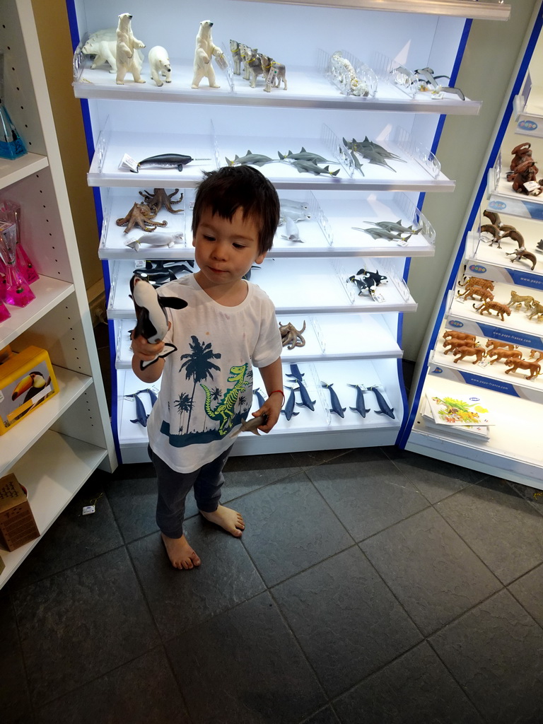 Max playing with toys in the Zee van Zoovenirs shop at the Diergaarde Blijdorp zoo