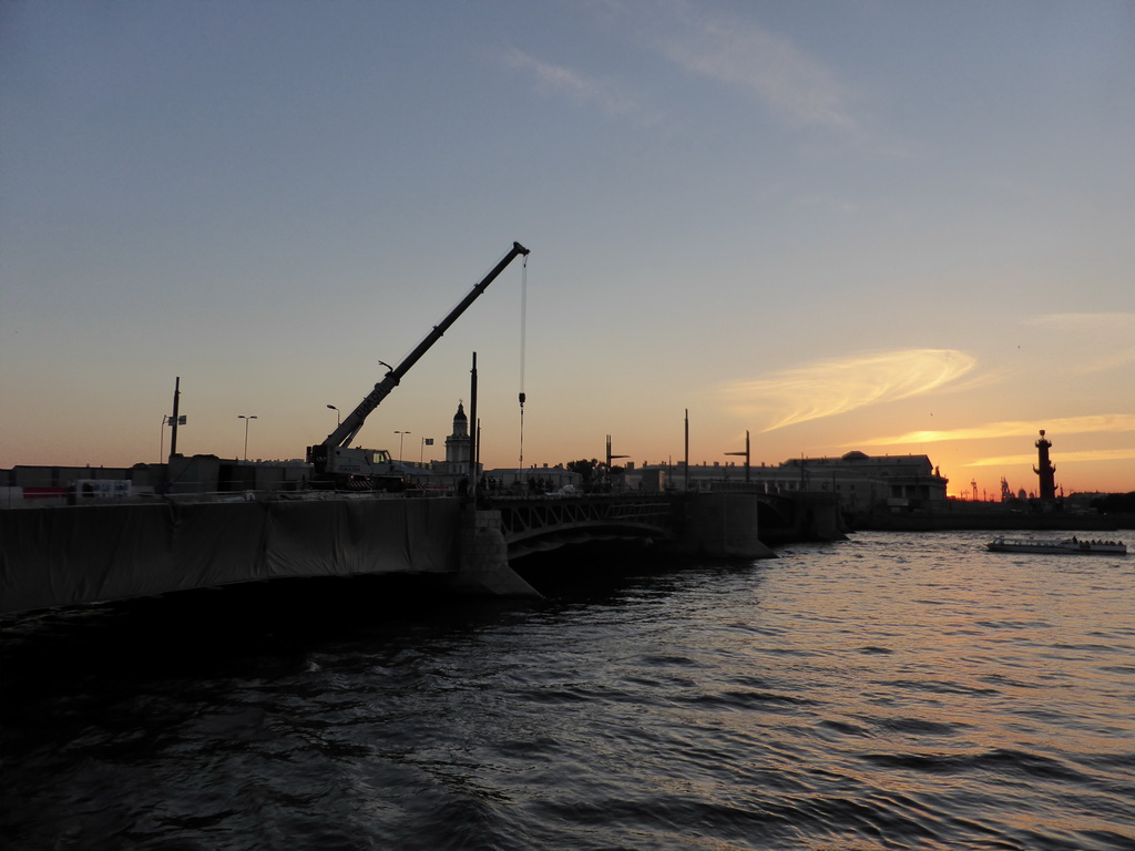 The Palace Bridge over the Neva river with the Rostral Columns, the Old Saint Petersburg Stock Exchange and the Kunstkamera museum, at sunset