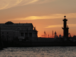 The Neva river, the Old Saint Petersburg Stock Exchange, the Rostral Columns and St. Vladimir`s Cathedral, at sunset