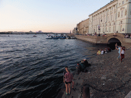 Boats in the Neva river, the Troitsky Bridge and the start of the Winter Canal, at sunset