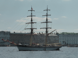 Boat in the Neva river and the front of the Winter Palace of the State Hermitage Museum, viewed from the Commandant`s Landing at the Peter and Paul Fortress
