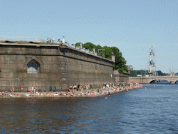 View from Commandant`s Landing on the outer wall of the Peter and Paul Fortress and the Troitsky Bridge over the Neva river