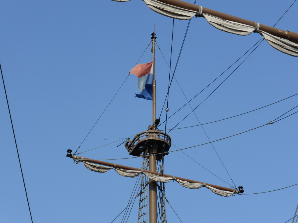 Mast with Dutch flag of the restaurant boat `The Flying Dutchman` in the Neva river