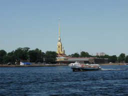 Hydrofoil in the Neva river and the tower of the Peter and Paul Cathedral at the Peter and Paul Fortress