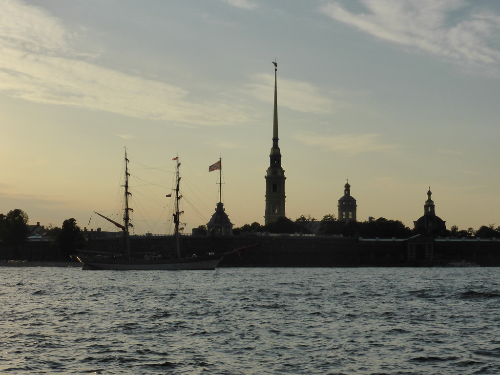Boat in the Neva river and the Peter and Paul Fortress with the Peter and Paul Cathedral, the Grand-Ducal Burial Chapel and the Flagstaff Tower, viewed from the tour boat