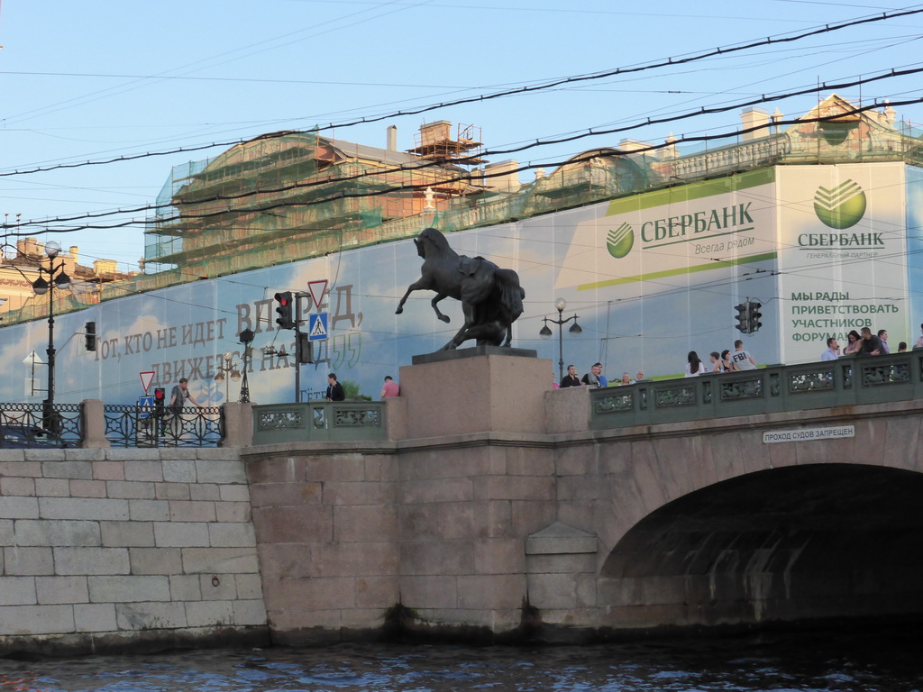 Statue at the Anichkov Bridge over the Fontanka river, viewed from the tour boat