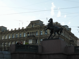 Statue at the Anichkov Bridge over the Fontanka river, viewed from the tour boat