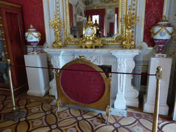 Mirror, clock, fireplace, vases and chandeleers in a room at the First Floor of the Winter Palace of the State Hermitage Museum