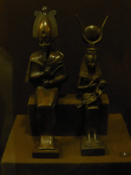 Bronze statuettes of Osiris and Isis with Horus on her lap in the Room of Ancient Egypt at the Ground Floor of the Winter Palace of the State Hermitage Museum