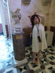 Miaomiao with a bust of Antinous as Hermes in the Room of the Great Vase at the Ground Floor of the New Hermitage of the State Hermitage Museum