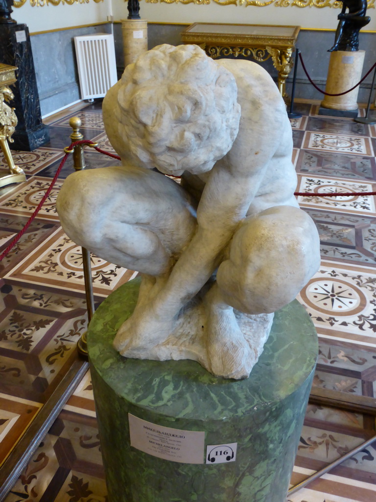 Sculpture `Crouching Boy` by Michelangelo at the Italian Cabinet at the First Floor of the New Hermitage of the State Hermitage Museum