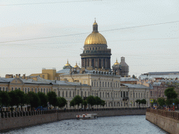 The Moika river and the dome of Saint Isaac`s Cathedral, viewed from the Potseluev bridge over the Moika river