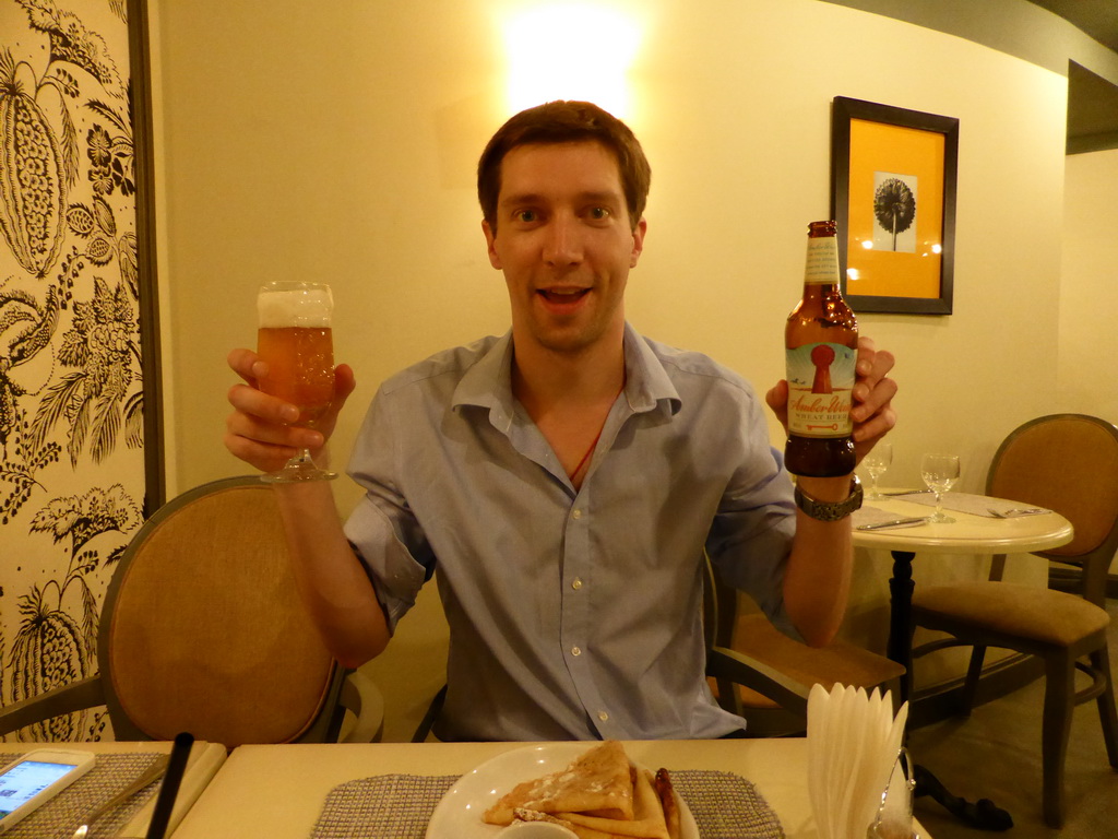 Tim with a Amber Weiss wheat beer and pancakes at the restaurant at the crossing of the Nevskiy Prospekt street and the Moika river embankment