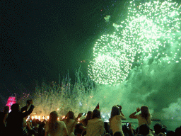 The Shtandart frigate in the Neva river and fireworks during the Scarlet Sails celebration at the Dvortsovaya street, by night