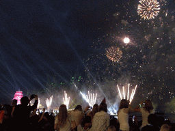 The Shtandart frigate in the Neva river and fireworks during the Scarlet Sails celebration at the Dvortsovaya street, by night