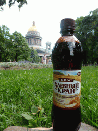 Bottle of kvass with a view on the Alexander Garden and Saint Isaac`s Cathedral