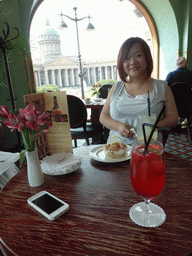 Miaomiao with cake and drinks at Cafe Singer at the Nevskiy Prospekt street