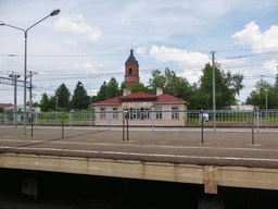 The Alexander Nevsky Church at Okulovka and the train platform of Okulovka Railway Station, viewed from the high speed train to Moscow