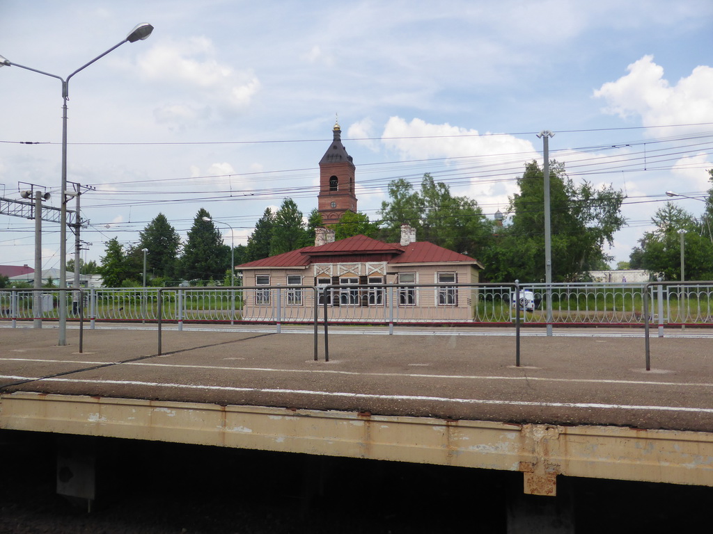 The Alexander Nevsky Church at Okulovka and the train platform of Okulovka Railway Station, viewed from the high speed train to Moscow