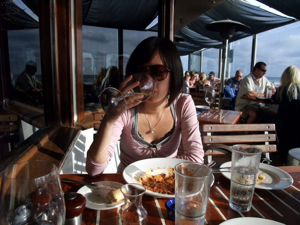 Mengjin having dinner in the restaurant `World Famous` at Pacific Beach Drive